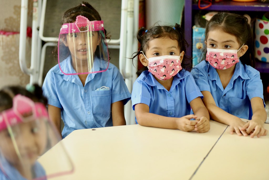 children wearing masks